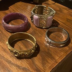 Four vintage cuff bracelets *one is marked Coro - silver, gold & purple colors